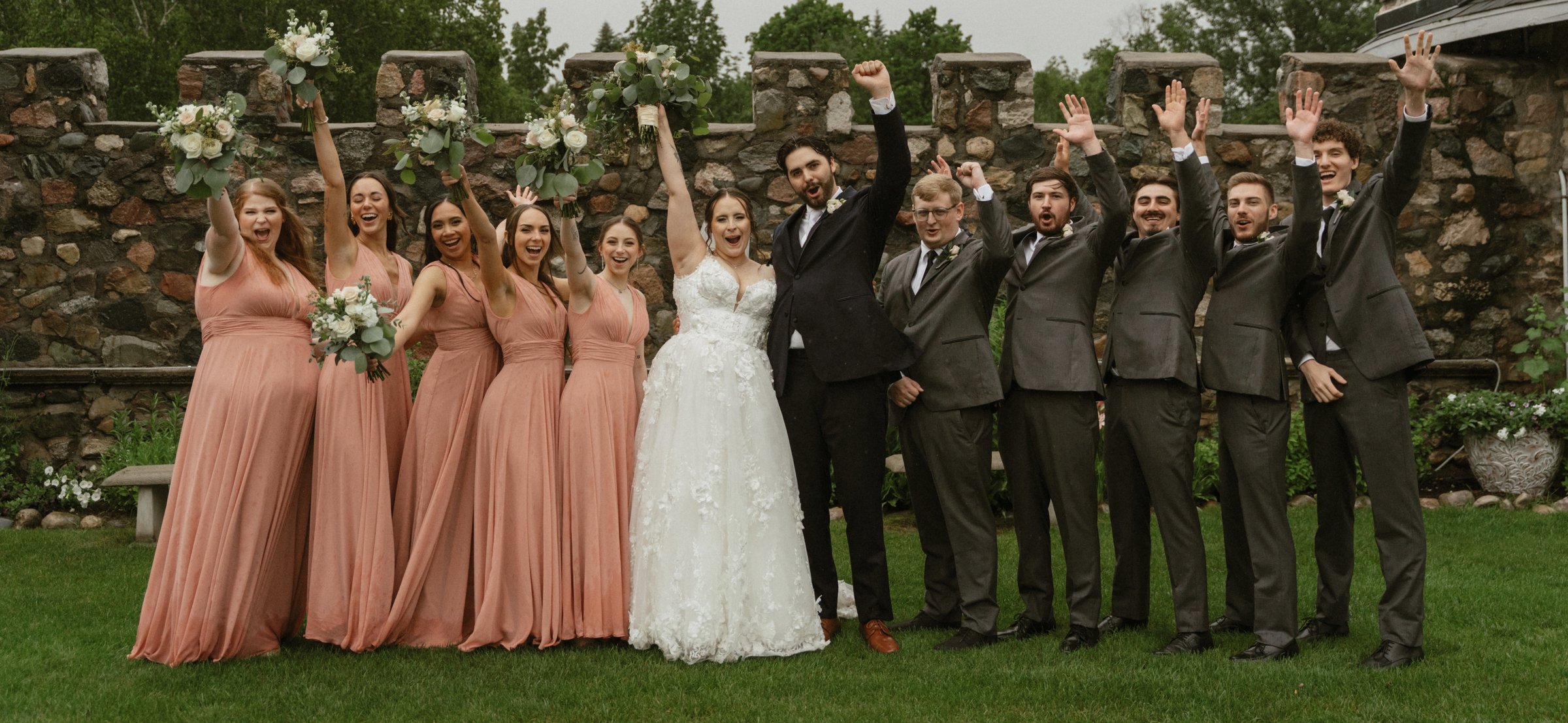 Bride and groom celebrating with their bridal party